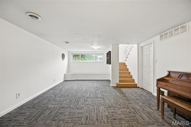 2649 Georgia Dr, Arnold, MO 63010 - below grade area with dark carpet and stairs