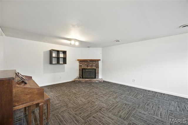 2649 Georgia Dr, Arnold, MO 63010 - unfurnished living room with dark colored carpet and a brick fireplace