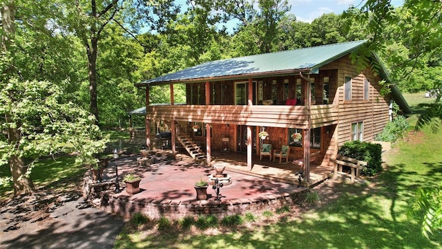 14938 Pike 139, Bowling Green, MO 63334 - view of front of property featuring a patio area, stairway, metal roof, and a deck