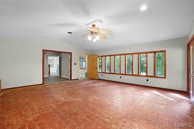 14938 Pike 139, Bowling Green, MO 63334 - unfurnished room featuring baseboards, lofted ceiling, ceiling fan, recessed lighting, and brick patterned flooring