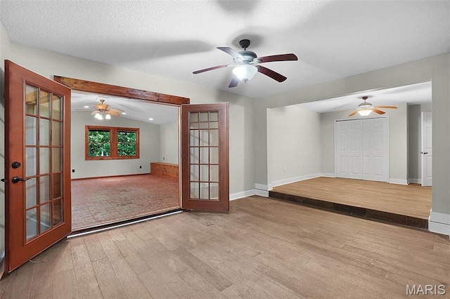 14938 Pike 139, Bowling Green, MO 63334 - unfurnished room with wood finished floors, a ceiling fan, french doors, and baseboards