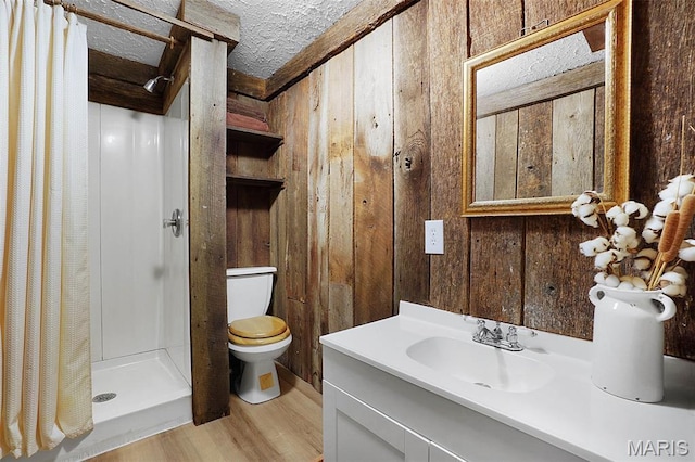 14938 Pike 139, Bowling Green, MO 63334 - bathroom with a stall shower, wooden walls, wood finished floors, toilet, and vanity