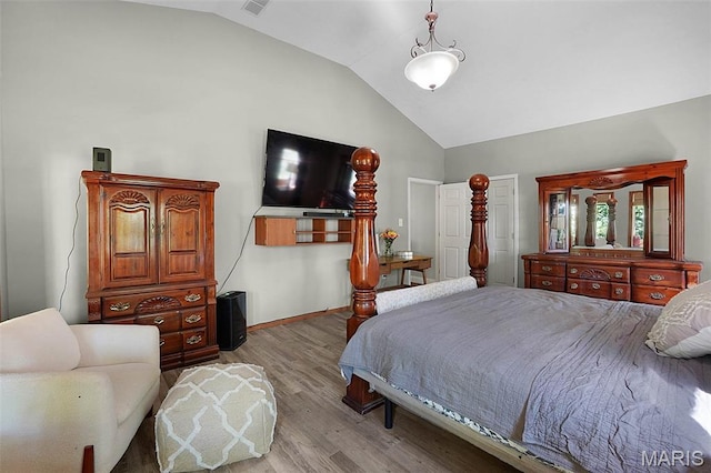 14938 Pike 139, Bowling Green, MO 63334 - bedroom with lofted ceiling, light wood finished floors, and baseboards