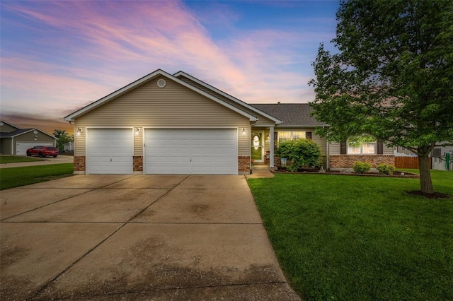 single story home with brick siding, driveway, a front yard, and a garage