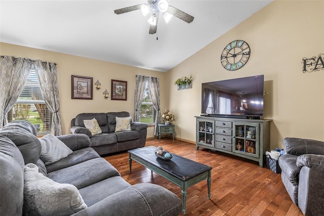 living room featuring a ceiling fan, wood finished floors, and high vaulted ceiling