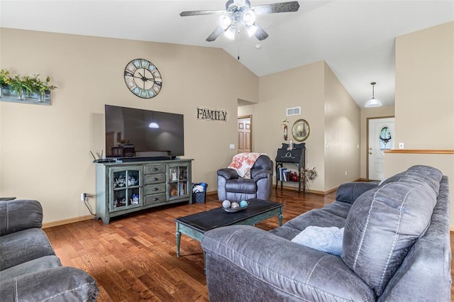 living area with ceiling fan, wood finished floors, baseboards, and high vaulted ceiling