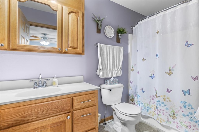 bathroom with toilet, curtained shower, a ceiling fan, and vanity