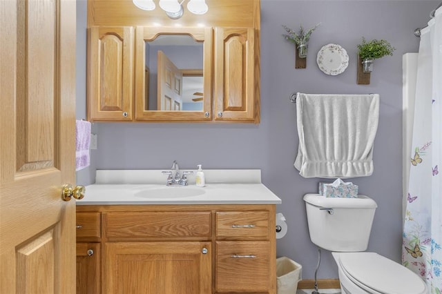 bathroom with toilet and vanity