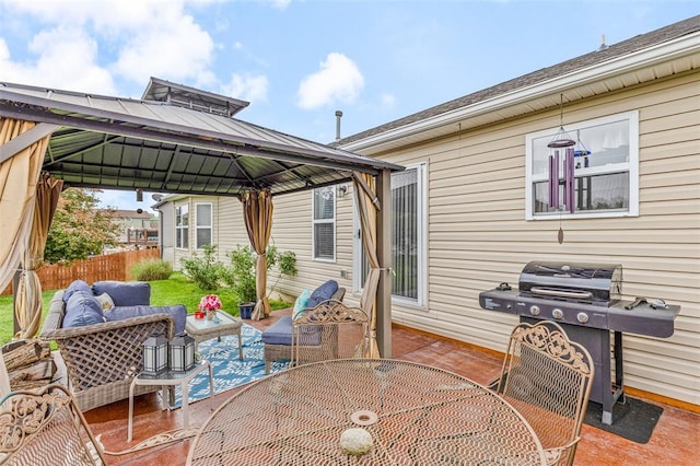 view of patio with outdoor dining space, a gazebo, an outdoor living space, fence, and a grill