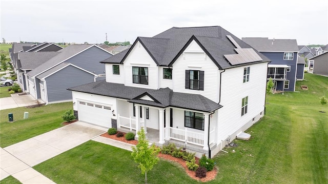 modern farmhouse featuring covered porch, concrete driveway, roof with shingles, and a front lawn