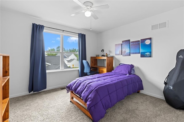 carpeted bedroom with baseboards and ceiling fan