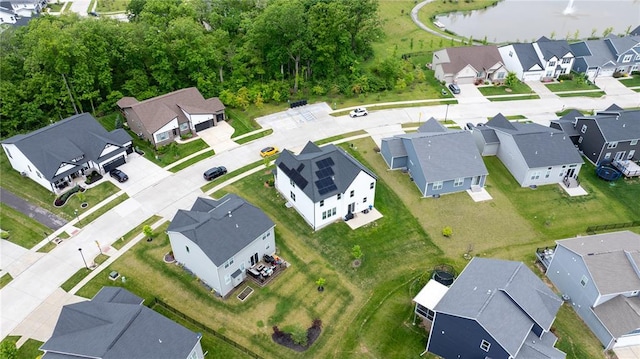 view of property location with nearby suburban area and a large body of water