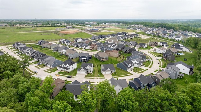 aerial view of property and surrounding area with nearby suburban area