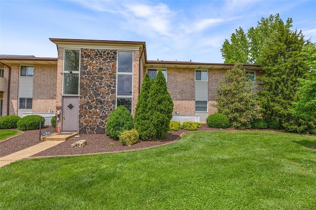 10003 Sakura Dr Unit B, Concord Township, MO 63128 - view of front facade featuring a front lawn and brick siding