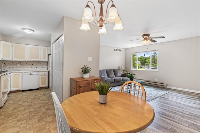 10003 Sakura Dr Unit B, Concord Township, MO 63128 - dining room with a baseboard radiator, ceiling fan, and a chandelier