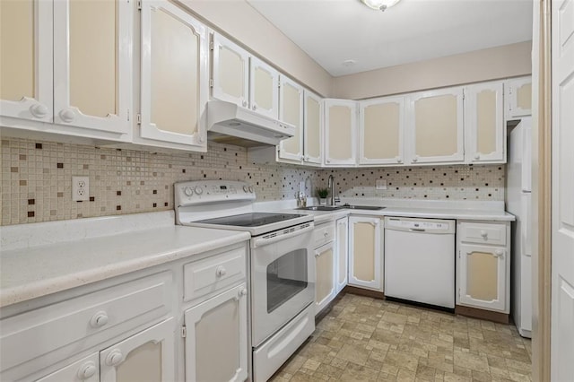 10003 Sakura Dr Unit B, Concord Township, MO 63128 - kitchen with white appliances, under cabinet range hood, a sink, tasteful backsplash, and light countertops