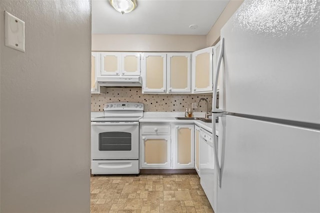 10003 Sakura Dr Unit B, Concord Township, MO 63128 - kitchen with white appliances, under cabinet range hood, a sink, stone finish flooring, and light countertops