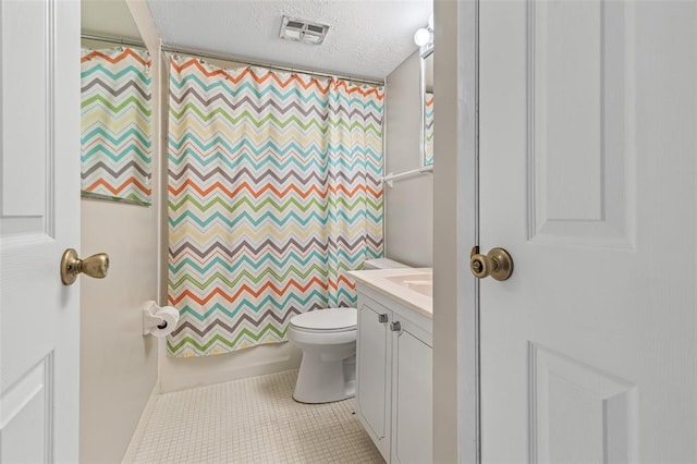 10003 Sakura Dr Unit B, Concord Township, MO 63128 - full bathroom featuring a textured ceiling, tile patterned floors, vanity, and toilet