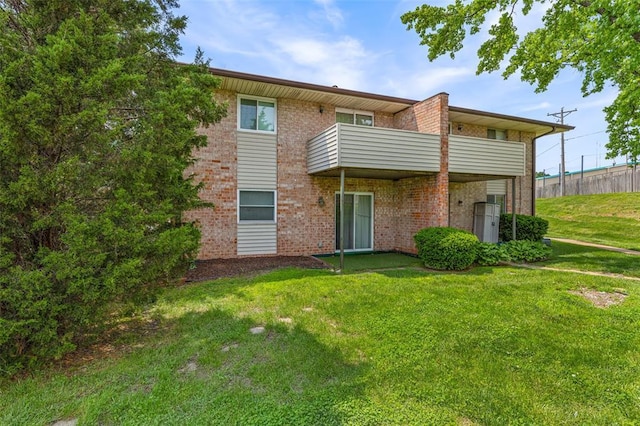 10003 Sakura Dr Unit B, Concord Township, MO 63128 - rear view of property with brick siding and a balcony