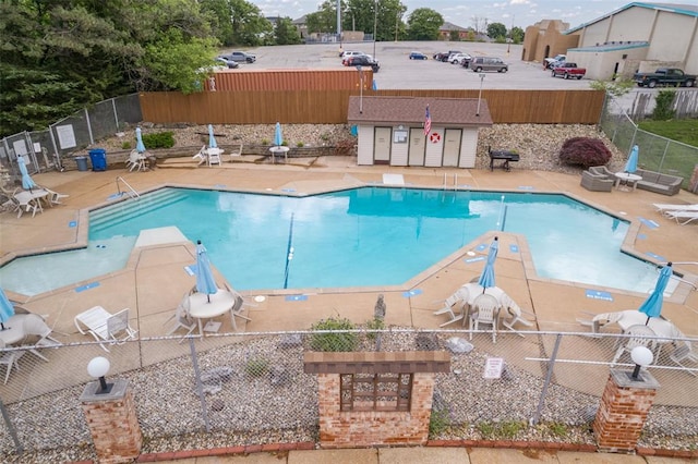 10003 Sakura Dr Unit B, Concord Township, MO 63128 - community pool featuring a patio area