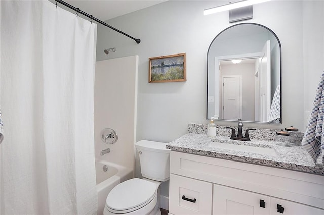 bathroom featuring shower / tub combo with curtain, vanity, and toilet