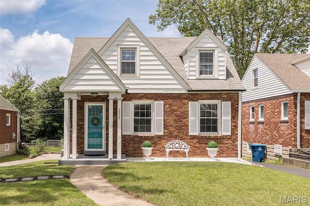 2235 Brown Rd, Overland, MO 63114 - view of front of house featuring a front lawn and brick siding