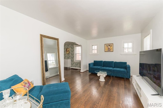 2235 Brown Rd, Overland, MO 63114 - living area featuring arched walkways and dark wood-type flooring