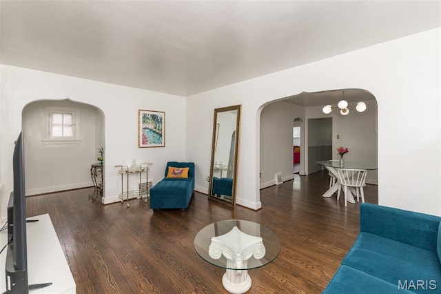 2235 Brown Rd, Overland, MO 63114 - living area featuring arched walkways and wood finished floors