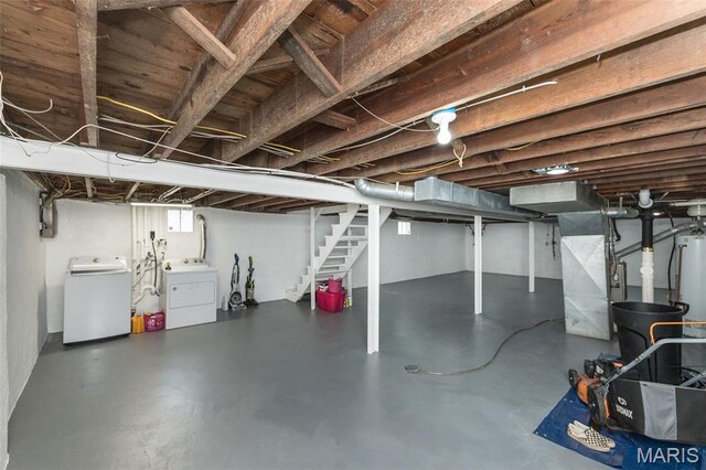 2235 Brown Rd, Overland, MO 63114 - basement featuring separate washer and dryer, stairs, and heating unit