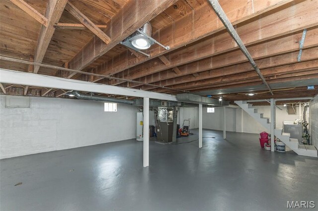 2235 Brown Rd, Overland, MO 63114 - below grade area featuring stairway, water heater, and heating unit