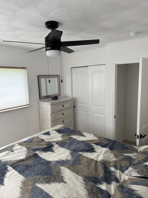 bedroom with a closet and a ceiling fan