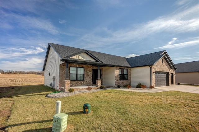 view of front of property with brick siding, driveway, a garage, a porch, and a front lawn