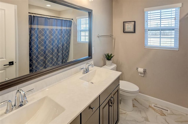 full bath featuring baseboards, toilet, marble look tiles, double vanity, and a shower with curtain