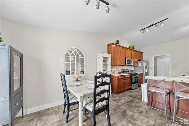 205 Stephanie Lynn Ct, Wentzville, MO 63385 - dining space with lofted ceiling, track lighting, and baseboards