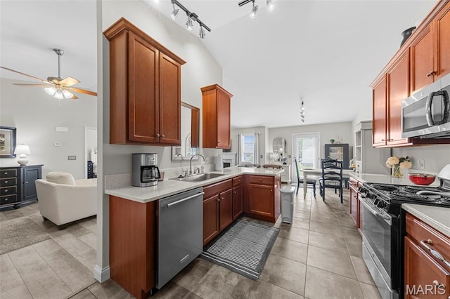 205 Stephanie Lynn Ct, Wentzville, MO 63385 - kitchen featuring stainless steel appliances, a sink, rail lighting, a ceiling fan, and open floor plan