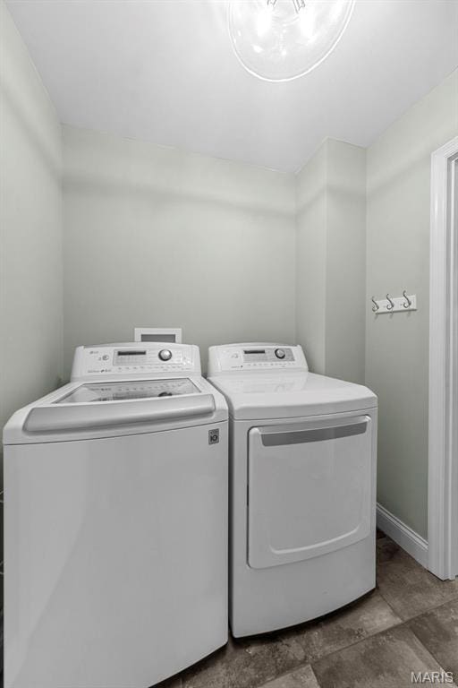 205 Stephanie Lynn Ct, Wentzville, MO 63385 - laundry area with washing machine and dryer and baseboards