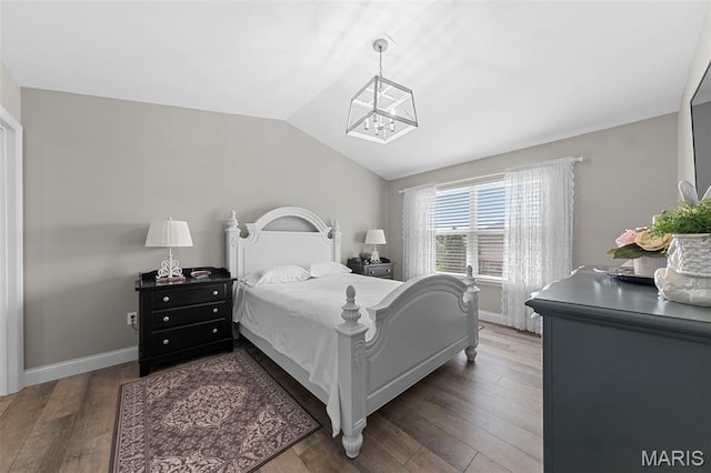 205 Stephanie Lynn Ct, Wentzville, MO 63385 - bedroom featuring a chandelier, vaulted ceiling, wood finished floors, and baseboards