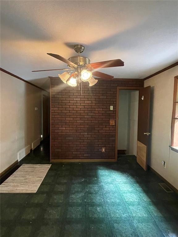 729 State Highway U, Burfordville, MO 63739 - empty room featuring a ceiling fan, ornamental molding, and baseboards