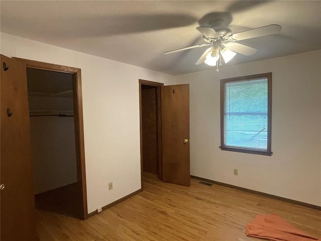 729 State Highway U, Burfordville, MO 63739 - unfurnished bedroom featuring light wood-style flooring, baseboards, and a ceiling fan