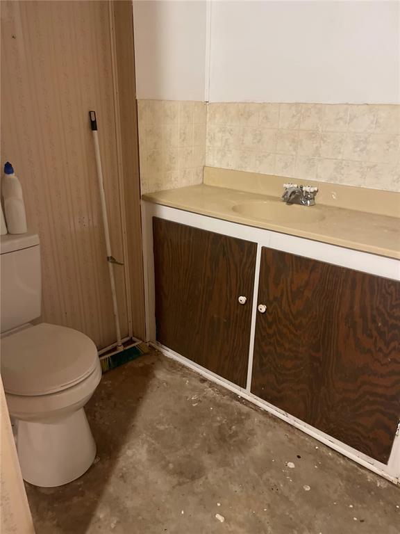 729 State Highway U, Burfordville, MO 63739 - bathroom with concrete floors, toilet, and vanity