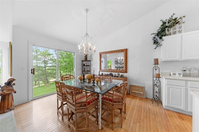 1008 Shire Ln, Eureka, MO 63025 - dining room featuring a chandelier, light wood-style floors, and vaulted ceiling