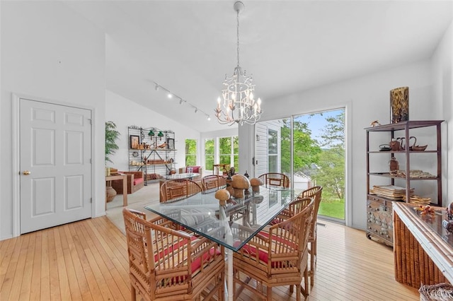 1008 Shire Ln, Eureka, MO 63025 - dining room with a chandelier, vaulted ceiling, and light wood finished floors