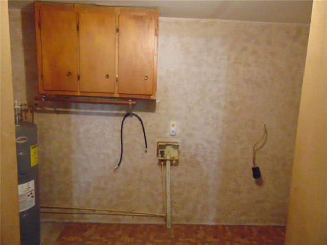 1184 Ripley 21n-10, Doniphan, MO 63935 - laundry room featuring water heater, cabinet space, and hookup for a washing machine