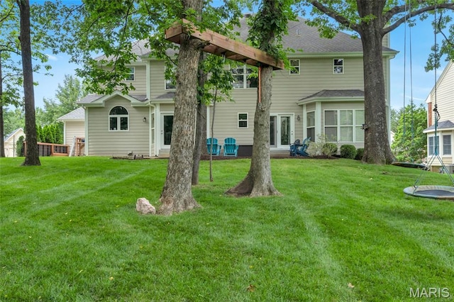 556 Autumn Bluff Dr, Ellisville, MO 63021 - rear view of property with a lawn