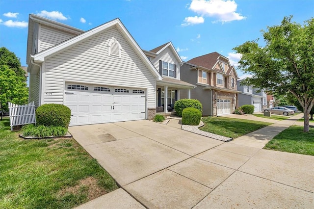 view of front of house with concrete driveway, a garage, a front lawn, and brick siding