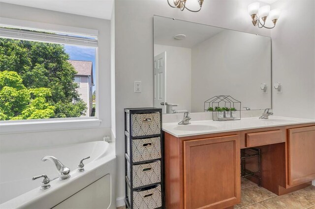 bathroom featuring double vanity, a garden tub, and a chandelier