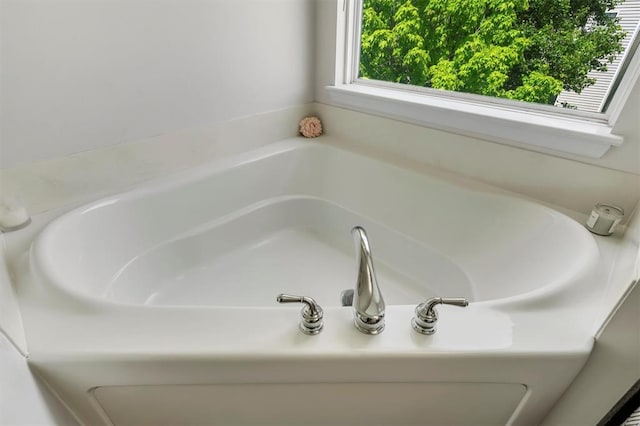 full bath with a garden tub