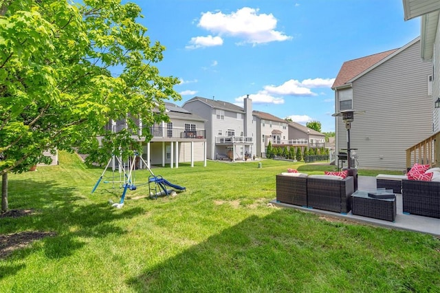 view of green lawn with outdoor lounge area, a residential view, and a patio area