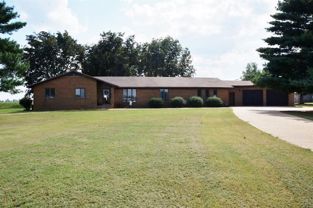7526 State Highway 164, Cardwell, MO 63829 - ranch-style house with brick siding, an attached garage, a front yard, and driveway