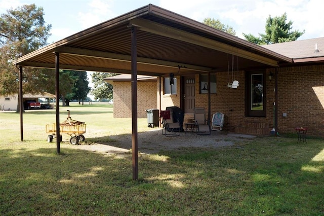 7526 State Highway 164, Cardwell, MO 63829 - back of property featuring brick siding and a lawn